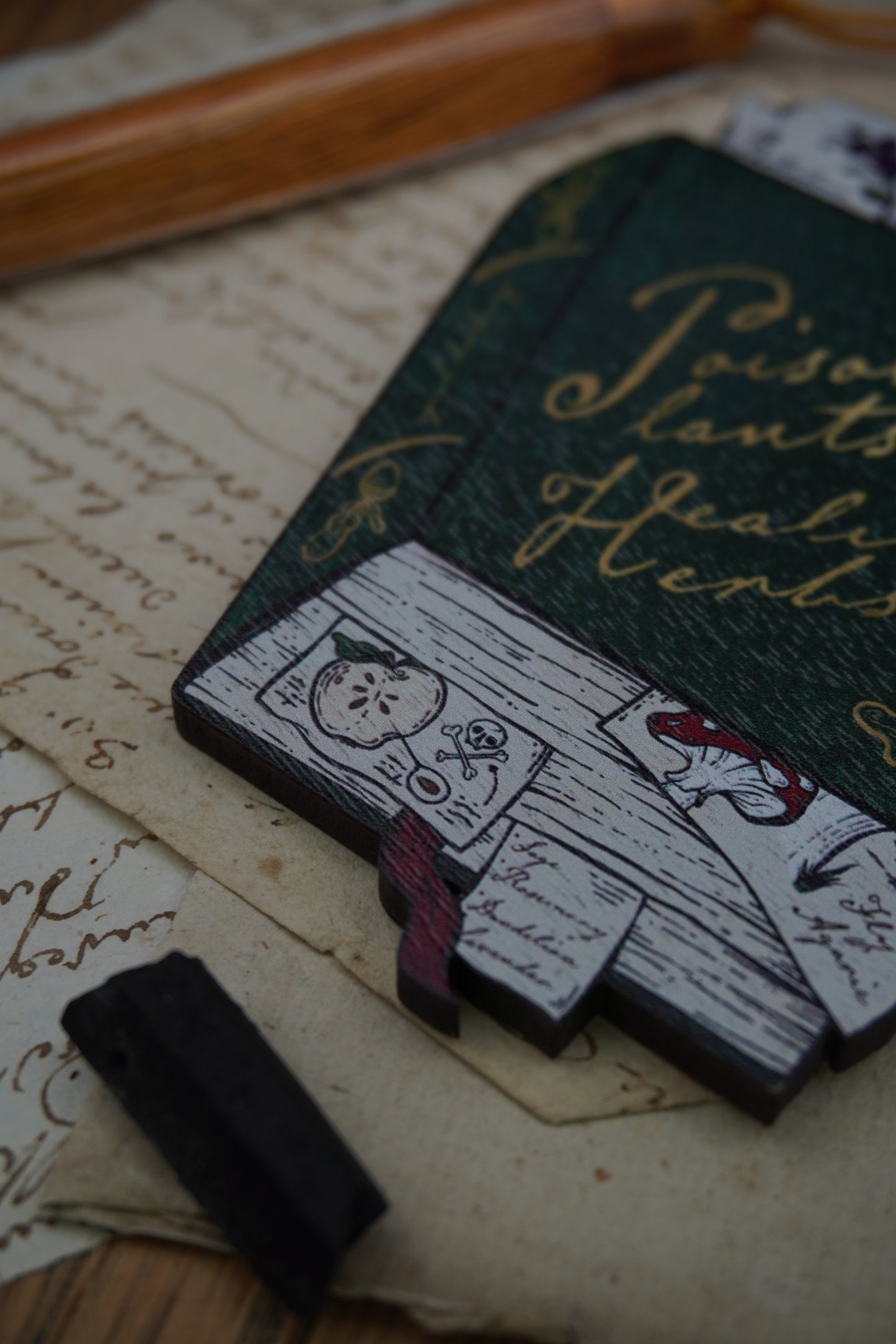 Wooden ornament | Poisonous Plants book