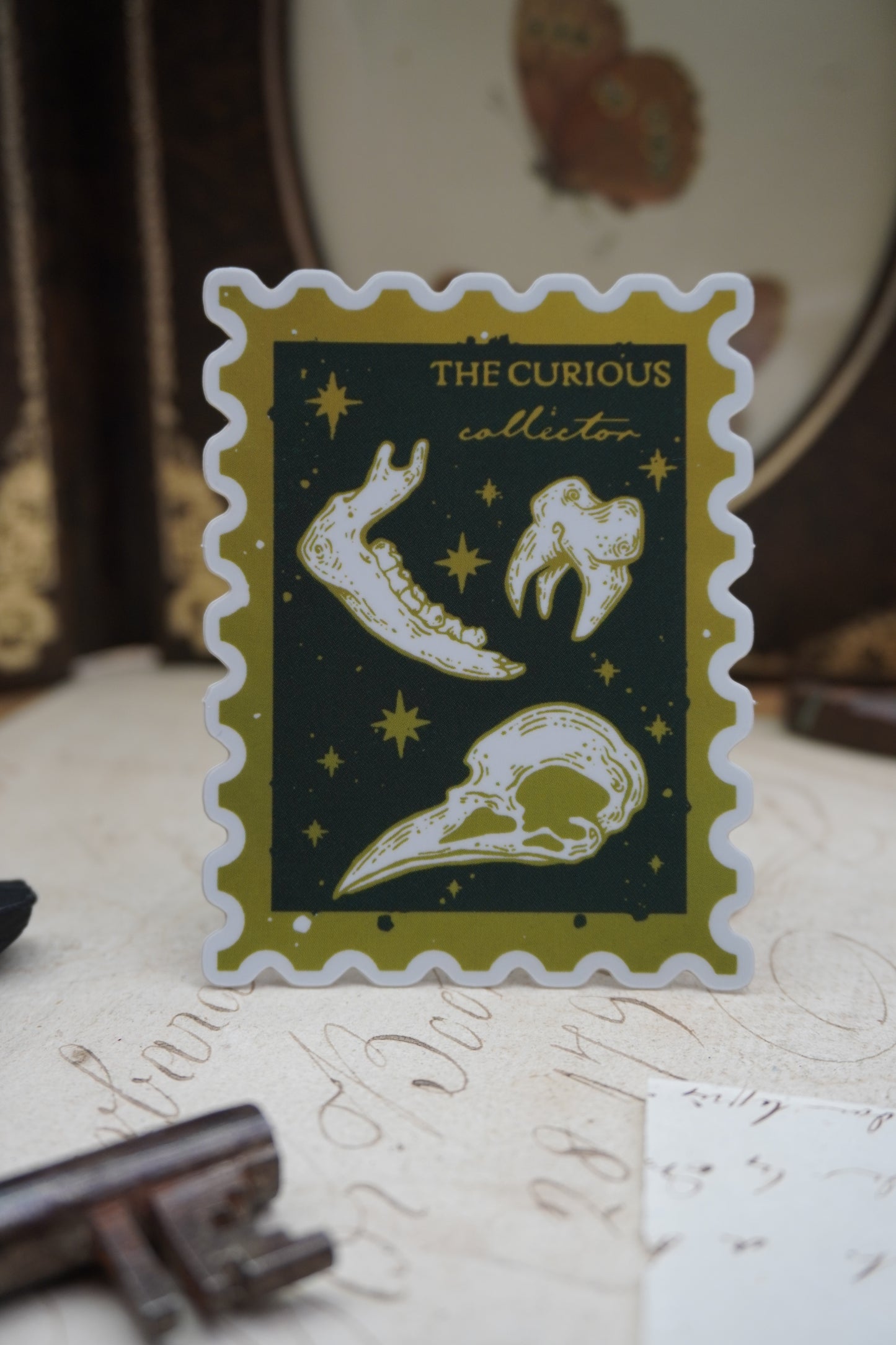 The Curious Collector stamp sticker | Holographic Matte