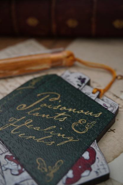 Wooden ornament | Poisonous Plants book