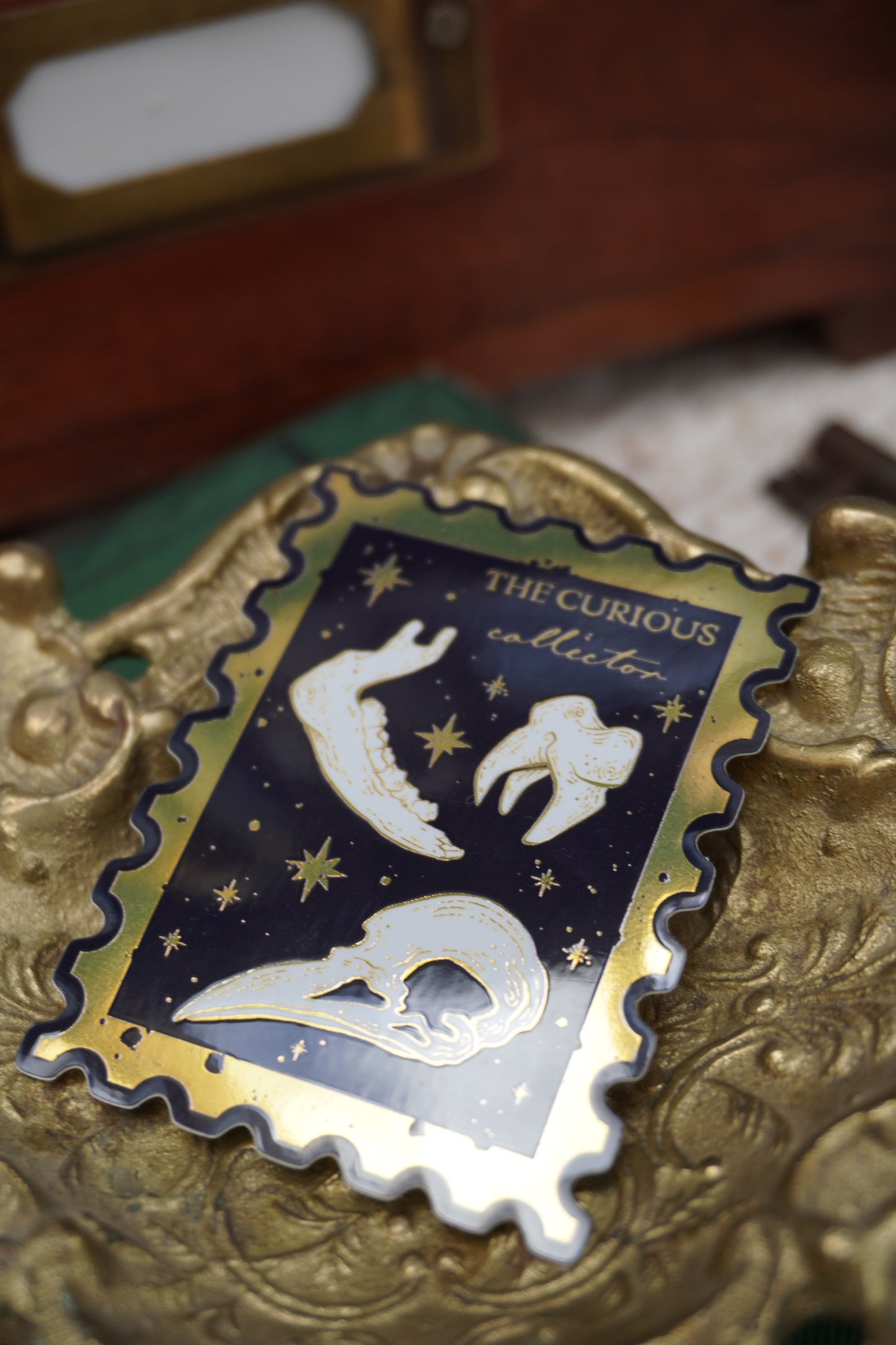 The Curious Collector bones Stamp sticker | Gold Mirror details