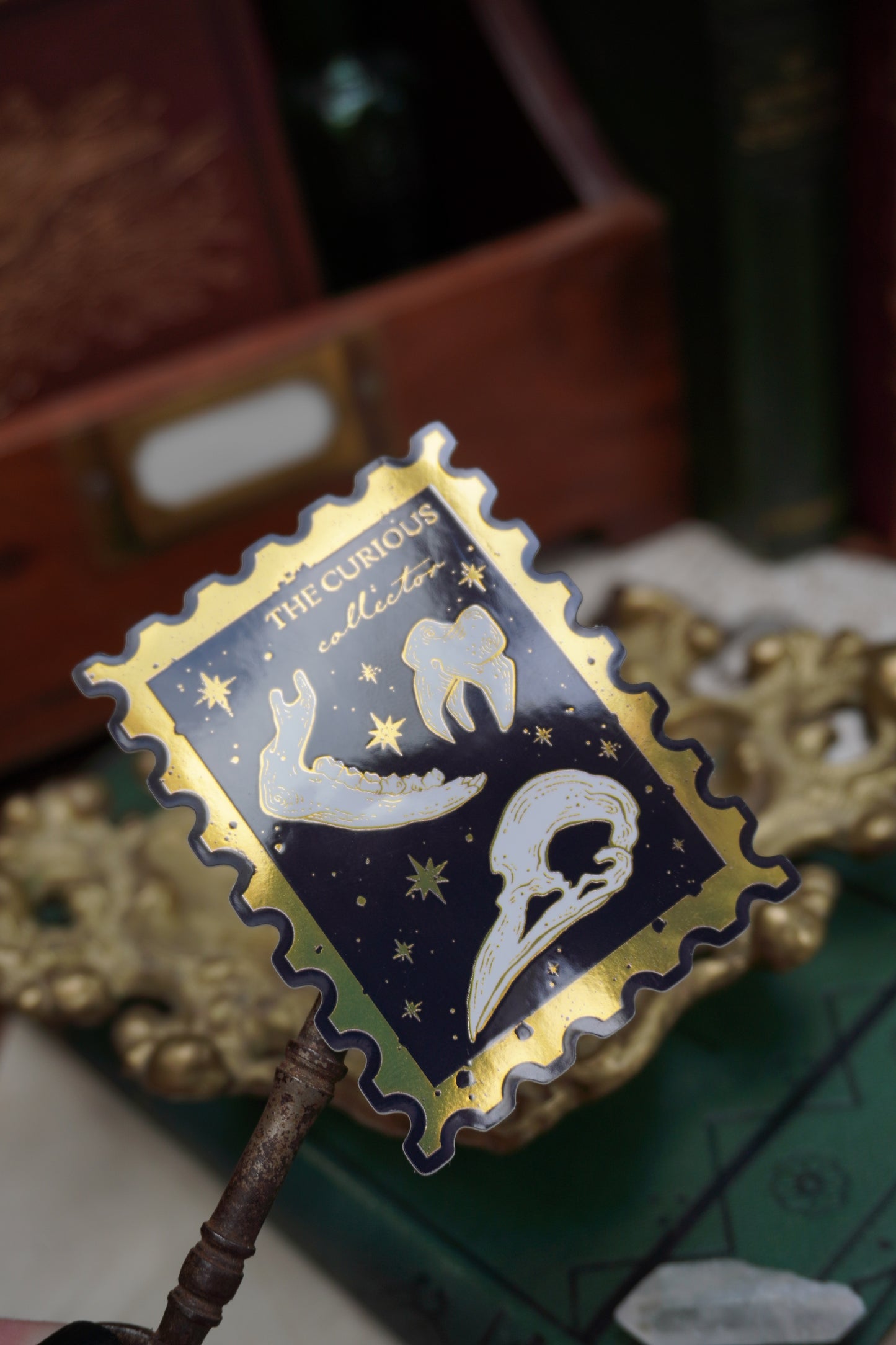 The Curious Collector bones Stamp sticker | Gold Mirror details