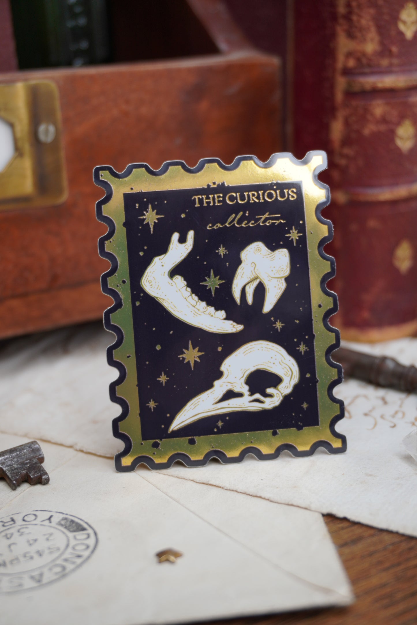 The Curious Collector bones Stamp sticker | Gold Mirror details