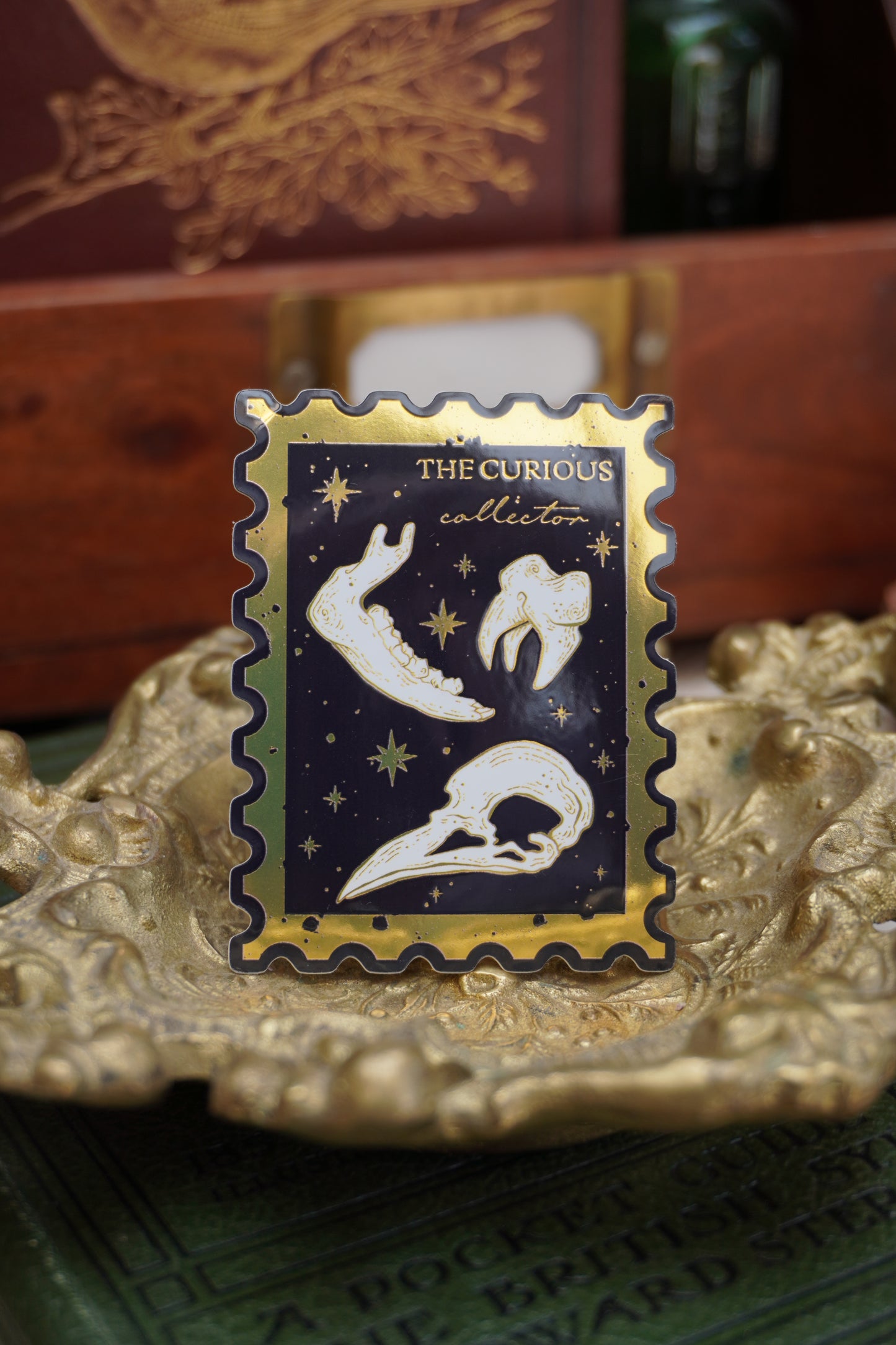 The Curious Collector bones Stamp sticker | Gold Mirror details